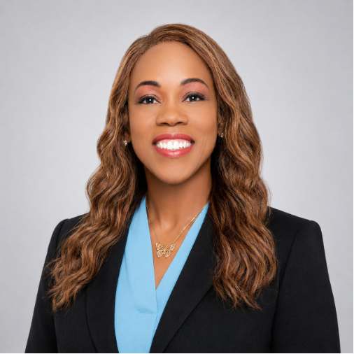 Professional headshot of Dr. Maydine L. Alcid-Digsby wearing a black blazer and teal top